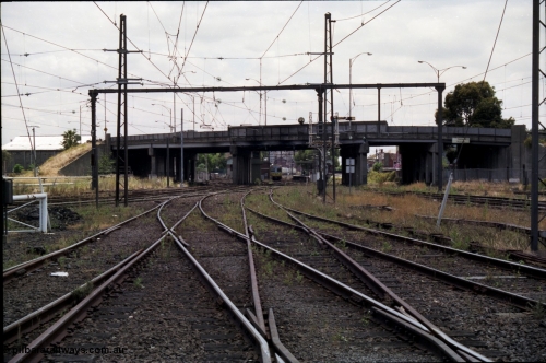 177-10
Newport station and yard overview taken from the workshops roads, Williamstown lines are at the right, I'm standing at the Newport Workshops No.1 and No.2 double track junction, the lines to Geelong are on the left beyond the white gate, a Comeng electric set is at the platform with the overbridge carrying Melbourne Road.
