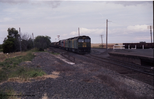 177-16
Gheringhap, down V/Line broad gauge goods train to Adelaide 9169 drifts to a stand to change the electric staff for a train order behind Australian National BL class locomotives BL 27 Clyde Engineering EMD model JT26C-2SS serial 83-1011 and class leader BL 26 'Bob Hawke' serial 83-1010 and V/Line S class S 313 'Alfred Deakin' Clyde Engineering EMD model A7 serial 61-230 and X class X 53 Clyde Engineering EMD model G26C serial 75-800.
Keywords: BL-class;BL27;Clyde-Engineering-Rosewater-SA;EMD;JT26C-2SS;83-1011;