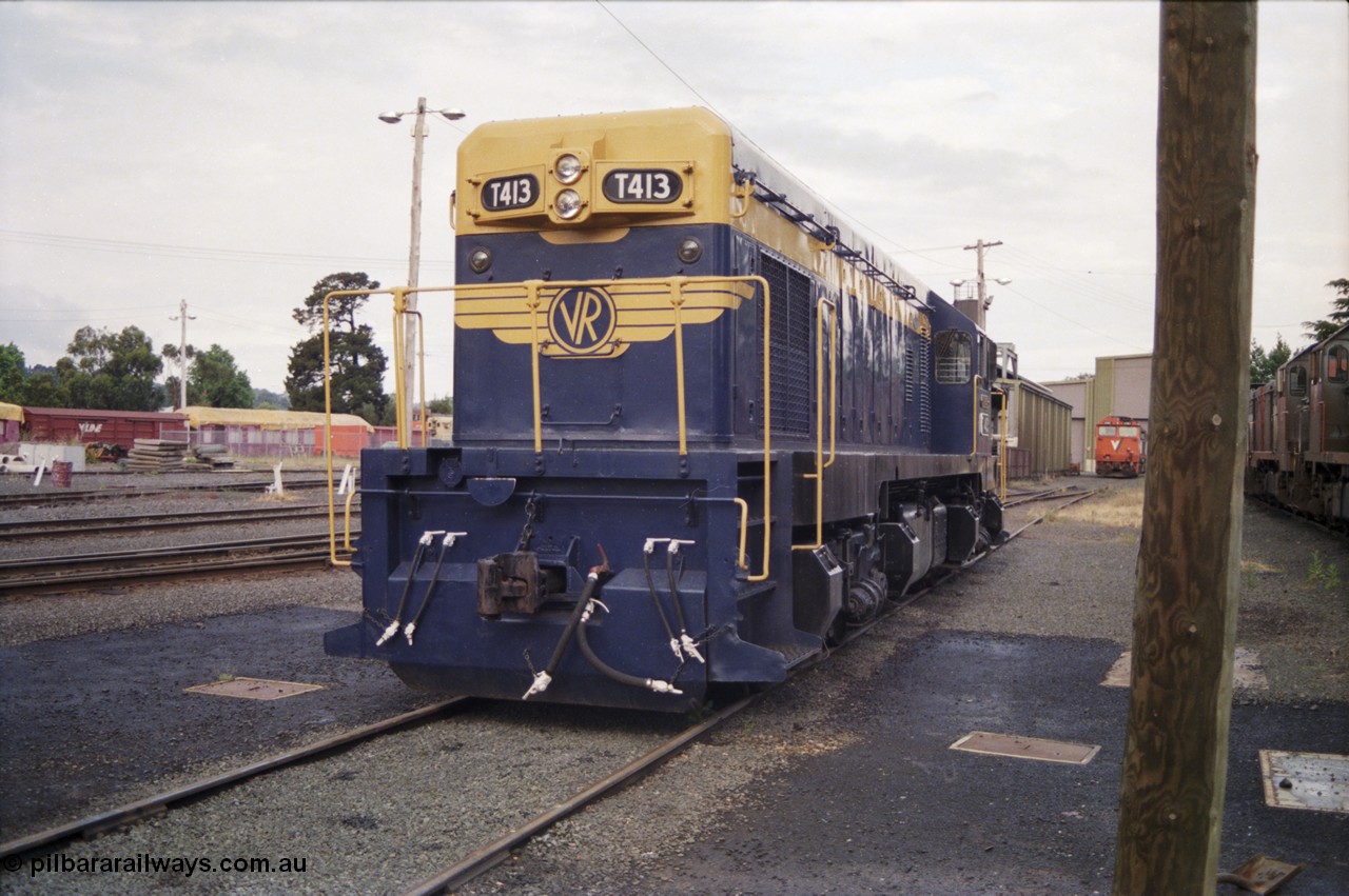 178-21
Ballarat East loco depot, former Australian Portland Cement loco, then bought by Victorian Railways and the only T class with a dynamic brake, T 413 'Wesley B. Mc Cann' Clyde Engineering EMD model G8B serial 56-107, long hood view.
Keywords: T413;Clyde-Engineering-Granville-NSW;EMD;G8B;56-107;