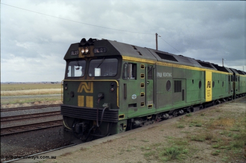 178-13
Maroona, station platform, Australian National BL class locomotive BL 27 Clyde Engineering EMD model JT26C-2SS serial 83-1011 with Paul Keating chalked on runs along the platform with V/Line's broad gauge down goods train to Adelaide, 9169.
Keywords: BL-class;BL27;Clyde-Engineering-Rosewater-SA;EMD;JT26C-2SS;83-1011;