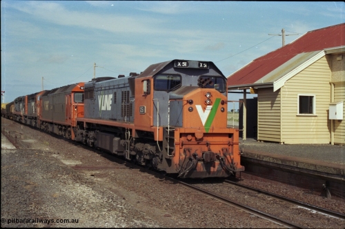 179-12
Gheringhap, V/Line broad gauge X class locomotive X 51 Clyde Engineering EMD model G26C serial 75-798 leads an impressive quad lash-up with G class G 512 Clyde Engineering EMD model JT26C-2SS serial 84-1240 and C classes C 510 Clyde Engineering EMD model GT26C serial 76-833 and C 509 serial 76-832 as they come to a stand at the platform with train number 9169 down goods to Adelaide.
Keywords: X-class;X51;Clyde-Engineering-Rosewater-SA;EMD;G26C;75-798;