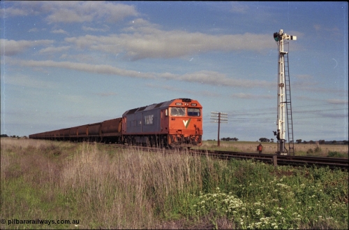 179-35
Gheringhap, track view looking east back towards Geelong with V/Line broad gauge G class G 521 Clyde Engineering EMD model JT26C-2SS serial 85-1234 locked away with down empty grain train 9121 consisting of 26 bogie grain waggons in Siding A, semaphore signal post 2 is the down home for the mainline.
Keywords: G-class;G521;Clyde-Engineering-Rosewater-SA;EMD;JT26C-2SS;85-1234;