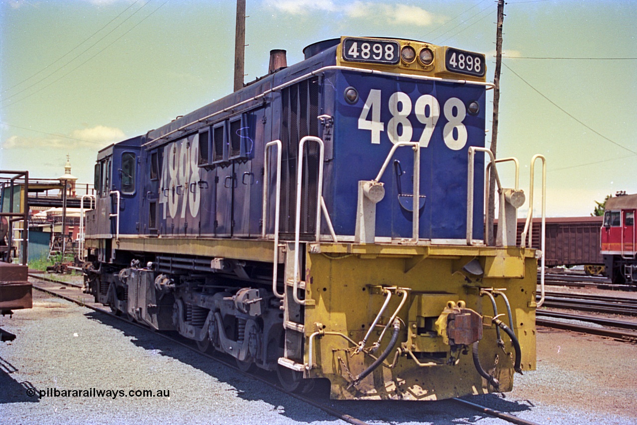 180-23
Albury, NSW, loco depot, NSWSRA standard gauge 48 class locomotive 4898 AE Goodwin ALCo model DL531 serial G3420-13 wearing Freight Rail livery rests near the fuel points.
Keywords: 48-class;4898;AE-Goodwin;ALCo;DL531;G3420-13;