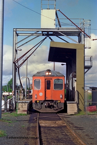 180-03
Seymour loco depot, fuel and sanding point, V/Line broad gauge Tulloch Ltd built DRC class diesel railcar DRC 40 takes on fuel having run a down Saturday morning passenger train from Melbourne.
Keywords: DRC-class;DRC40;Tulloch-Ltd-NSW;