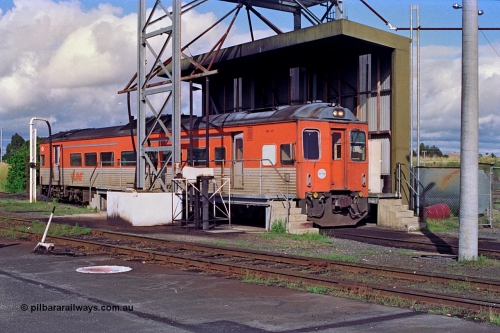 180-04
Seymour loco depot, fuel and sanding point, V/Line broad gauge Tulloch Ltd built DRC class diesel railcar DRC 40 takes on fuel having run a down Saturday morning passenger train from Melbourne.
Keywords: DRC-class;DRC40;Tulloch-Ltd-NSW;