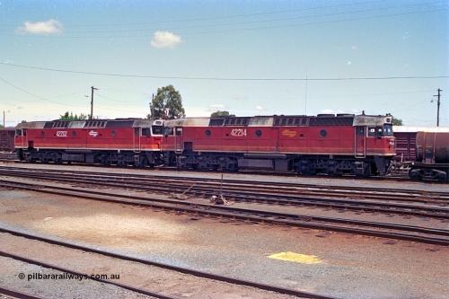 180-19
Albury, NSW, yard view looking across from the depot, two standard gauge NSWSRA 422 class locomotives 42202 Clyde Engineering EMD model J26C serial 69-657 and 42214 serial 69-669.
Keywords: 422-class;42202;42214;Clyde-Engineering-Granville-NSW;EMD;J26C;69-657;69-669;