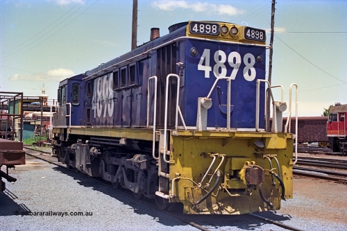 180-22
Albury, NSW, loco depot, NSWSRA standard gauge 48 class locomotive 4898 AE Goodwin ALCo model DL531 serial G3420-13 wearing Freight Rail livery rests near the fuel points.
Keywords: 48-class;4898;AE-Goodwin;ALCo;DL531;G3420-13;