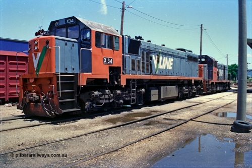 180-27
Wodonga loco depot fuel point, V/Line broad gauge X class X 34 Clyde Engineering EMD model G16C serial 66-487 and H class H 5 Clyde Engineering EMD model G18B serial 68-632 wait to run the Sunday evening up Albury slab steel train.
Keywords: X-class;X34;Clyde-Engineering-Granville-NSW;EMD;G16C;66-487;