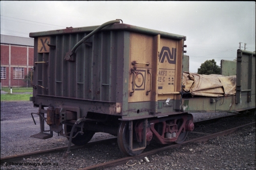181-09
Trafalgar yard, loaded Australian National AKFX type bogie steel waggon AKFX 12, in AN green and yellow livery, number board view.
Keywords: AKFX-type;AKFX12;