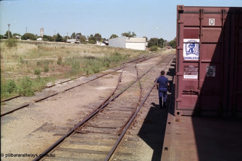 182-09
Wahgunyah, yard view looking towards terminus, crossover points from No.3 Road to 4 have been spiked and levers have been removed, bogie container waggons for Uncle Tobys are on No.2 Road.
