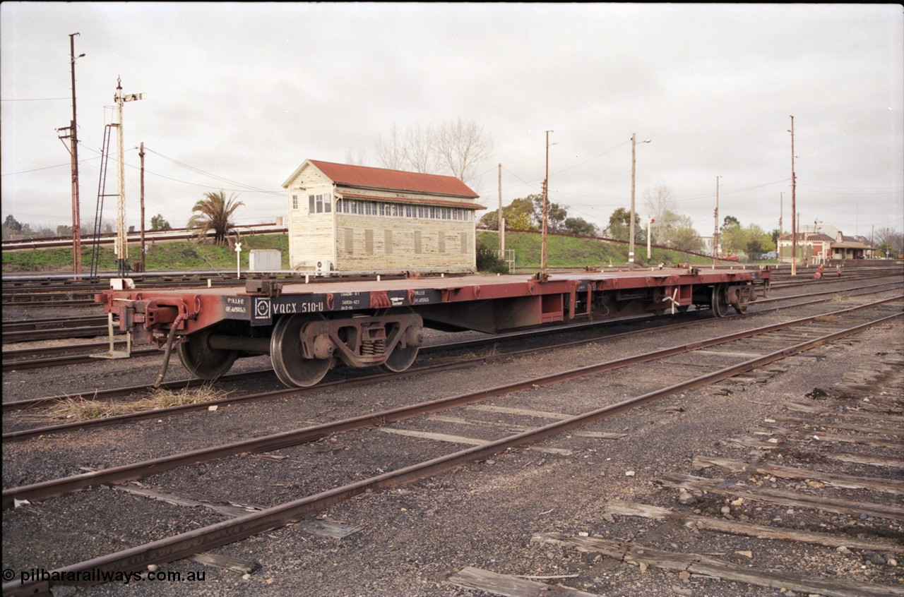 183-17
Benalla yard view, removed tracks, V/Line broad gauge VQCX type 60 foot bogie container waggon VQCX 510 stands in the yard built in May 1969 by Victorian Railways Newport Workshops as an FQX type, recoded to FQF in 1978, then VQCY in 1979 and then VQCX in 1988, Benalla B Signal Box and station are visible, along with some still standing mechanical signals.
Keywords: VQCX-type;VQCX510;Victorian-Railways-Newport-WS;FQX-type;