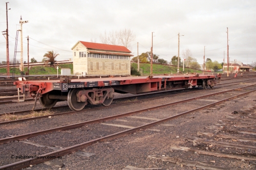 183-17
Benalla yard view, removed tracks, V/Line broad gauge VQCX type 60 foot bogie container waggon VQCX 510 stands in the yard built in May 1969 by Victorian Railways Newport Workshops as an FQX type, recoded to FQF in 1978, then VQCY in 1979 and then VQCX in 1988, Benalla B Signal Box and station are visible, along with some still standing mechanical signals.
Keywords: VQCX-type;VQCX510;Victorian-Railways-Newport-WS;FQX-type;