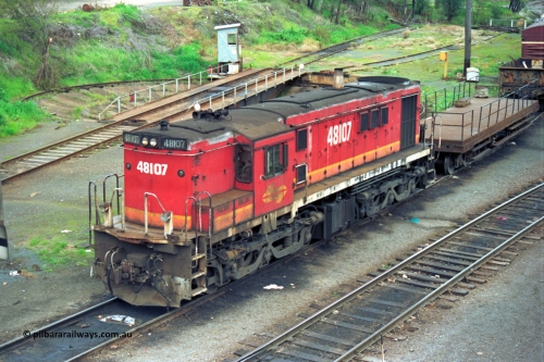 184-09
Albury loco depot, view across yard, NSWSRA standard gauge candy liveried 48 class yard shunt loco 48107 AE Goodwin ALCo model DL531 serial G3420-22, shunters float, turntable and pit, elevated view.
Keywords: 48-class;48107;AE-Goodwin;ALCo;DL531;G3420-22;