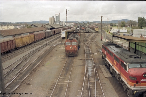 184-20
Albury station yard overview, loco depot, V/Line standard gauge G class G 527 Clyde Engineering EMD model JT26C-2SS serial 88-1257 receives attention prior to heading back to Melbourne with a south bound goods, NSWSRA standard gauge candy liveried 44 class 4466 AE Goodwin ALCo model DL500B serial G3421-06 stands at the other fuel point on the right.
Keywords: G-class;G527;Clyde-Engineering-Somerton-Victoria;EMD;JT26C-2SS;88-1257;44-class;4466;AE-Goodwin;ALCo;DL500B;G3421-6;