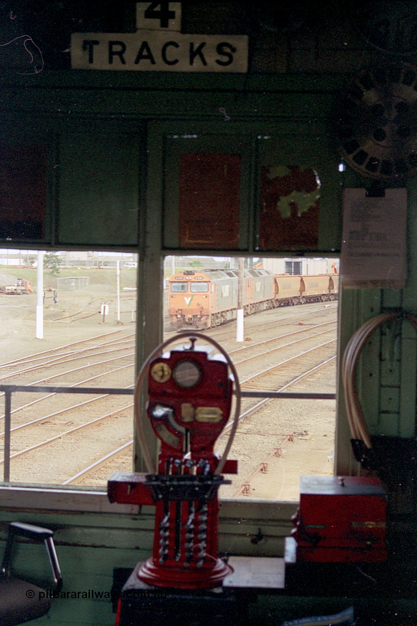 185-20
North Geelong C Signal Box, internal view of the miniature electric staff machine for the Gheringhap section with a staff ready in the hoop for V/Line grain train 9123 visible in the window.
