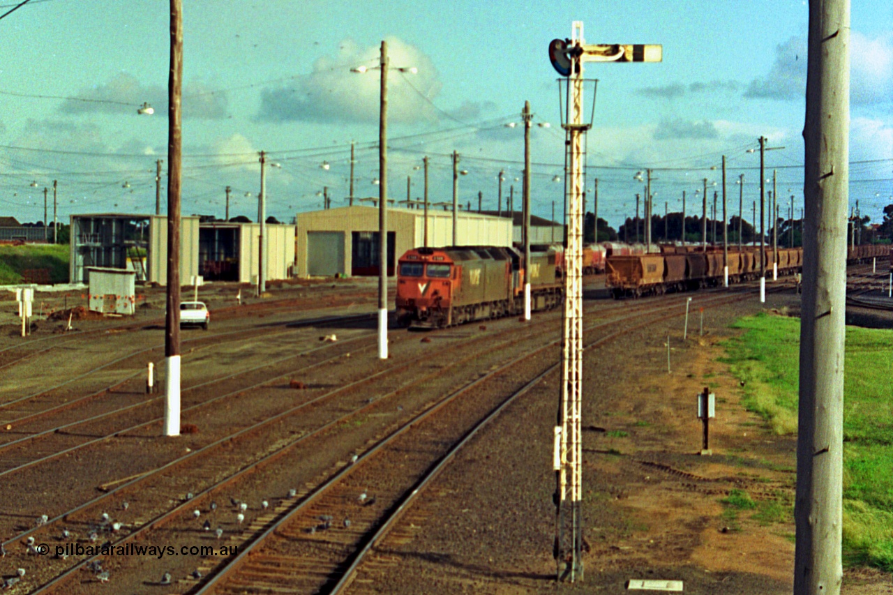 185-28
North Geelong Yard, view from North Geelong C Signal Box of light engines G class G 528 Clyde Engineering EMD model JT26C-2SS serial 88-1258 and X class X 41 Clyde Engineering EMD model G26C serial 70-704 having cut off the empty grain train consist which will form 9125 down empty grain.
Keywords: G-class;G528;Clyde-Engineering-Somerton-Victoria;EMD;JT26C-2SS;88-1258;