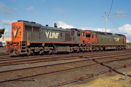 185-15
North Geelong Yard, V/Line grain loop shunt engines X class locomotive X 41 Clyde Engineering EMD model G26C serial 70-704 long end leading and G class locomotive G 528 Clyde Engineering EMD model JT26C-2SS serial 88-1258 stand in the yard awaiting the road to the arrivals to collect another loaded grain consist.
Keywords: X-class;X41;Clyde-Engineering-Granville-NSW;EMD;G26C;70-704;