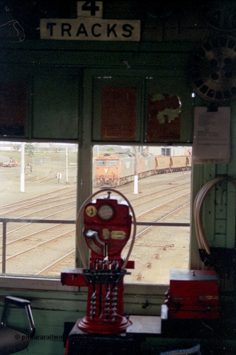 185-20
North Geelong C Signal Box, internal view of the miniature electric staff machine for the Gheringhap section with a staff ready in the hoop for V/Line grain train 9123 visible in the window.
