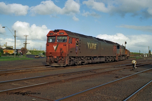 185-25
North Geelong C Box, empty grain train behind G class G 528 Clyde Engineering EMD model JT26C-2SS serial 88-1258 and X class X 41 Clyde Engineering EMD model G26C serial 70-704 as they pass North Geelong C Box, shunter in cab doorway, ground dwarf disc signal 18 in the foreground.
Keywords: G-class;G528;Clyde-Engineering-Somerton-Victoria;EMD;JT26C-2SS;88-1258;