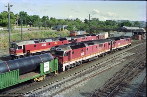 189-21
Albury yard view with a stabled Victorian bound goods train with dual 81 class units 8178 Clyde Engineering EMD model JT26C-2SS serial 85-1097 and 8170 serial 85-1089 on the point with 422 class 42208 Clyde Engineering EMD model J26C serial 69-663 and another 81 class 8169 all in the NSWSRA candy livery and Victorian interloper V/Line G class G 519 also a Clyde Engineering EMD model JT26C-2SS serial 85-1232 in the background on the turntable radial roads, Albury Station Signal Box and former trans-shipping shed visible at the far right.
Keywords: 81-class;8170;Clyde-Engineering-Kelso-NSW;EMD;JT26C-2SS;85-1089;