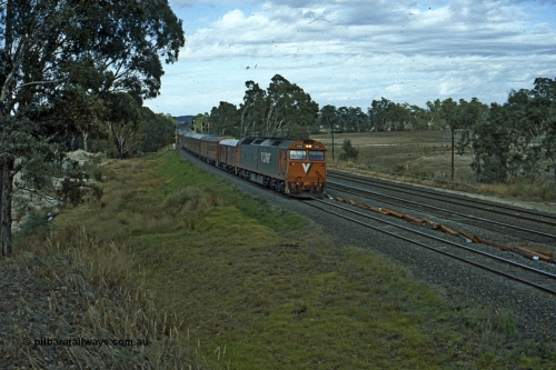 191-09
Seymour, looking south at the northern most Goulburn River bridge, end of Gordon Crescent, Seymour, quarry to the left. V/Line G class G 519 with down Inter-Capital Daylight on the standard gauge, broad gauge lines on the right, Seymour behind photographer.
Keywords: G-class;G519;Clyde-Engineering-Rosewater-SA;EMD;JT26C-2SS;85-1232