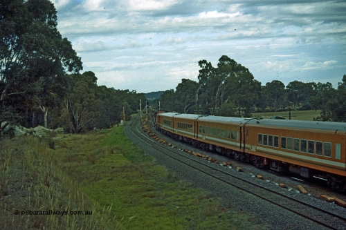 191-11
Seymour, looking south at the northern most Goulburn River bridge, end of Gordon Crescent, Seymour, quarry to the left. V/Line N class on UP Albury passenger on broad gauge, standard gauge on the left, Seymour behind photographer.
