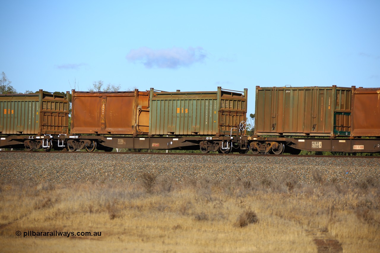 161111 2413
Kalgoorlie, Malcolm freighter train 5029, waggon AQNY 32153 one of sixty two waggons built by Goninan WA in 1998 as WQN type for Murrin Murrin container traffic with a Bis Industries roll-top 55UA type sulphur container 200628 and an original style sulphur container S24 with sliding tarpaulin roof.
Keywords: AQNY-type;AQNY32153;Goninan-WA;WQN-type;