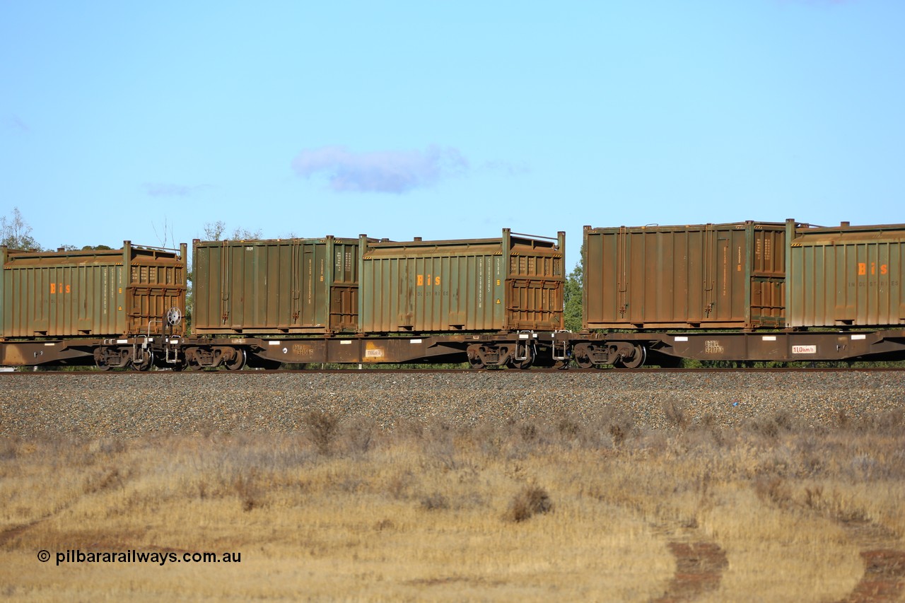161111 2427
Kalgoorlie, Malcolm freighter train 5029, waggon AQNY 32156 one of sixty two waggons built by Goninan WA in 1998 as WQN type for Murrin Murrin container traffic with a Bis Industries roll-top 55UA type sulphur container SBIU 200605 and an undecorated Bis Industries hard-top 25U0 type sulphur container BISU 100065.
Keywords: AQNY-type;AQNY32156;Goninan-WA;WQN-type;