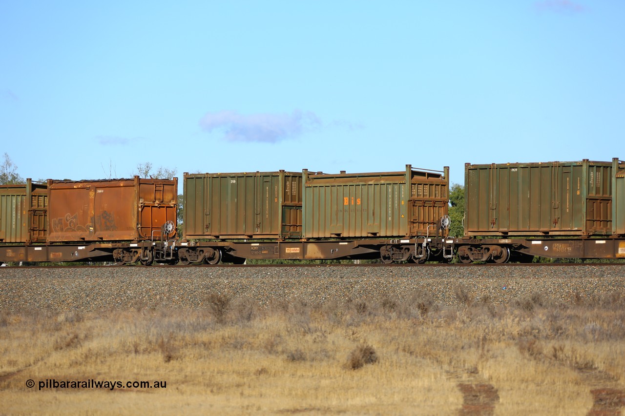 161111 2428
Kalgoorlie, Malcolm freighter train 5029, waggon AQNY 32160 one of sixty two waggons built by Goninan WA in 1998 as WQN type for Murrin Murrin container traffic with a Bis Industries roll-top 55UA type sulphur container SBIU 200601 and an undecorated Bis Industries hard-top 25U0 type sulphur container BISU 100015.
Keywords: AQNY-type;AQNY32160;Goninan-WA;WQN-type;
