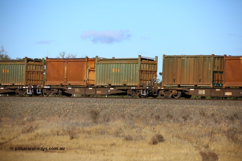 161111 2413
Kalgoorlie, Malcolm freighter train 5029, waggon AQNY 32153 one of sixty two waggons built by Goninan WA in 1998 as WQN type for Murrin Murrin container traffic with a Bis Industries roll-top 55UA type sulphur container 200628 and an original style sulphur container S24 with sliding tarpaulin roof.
Keywords: AQNY-type;AQNY32153;Goninan-WA;WQN-type;
