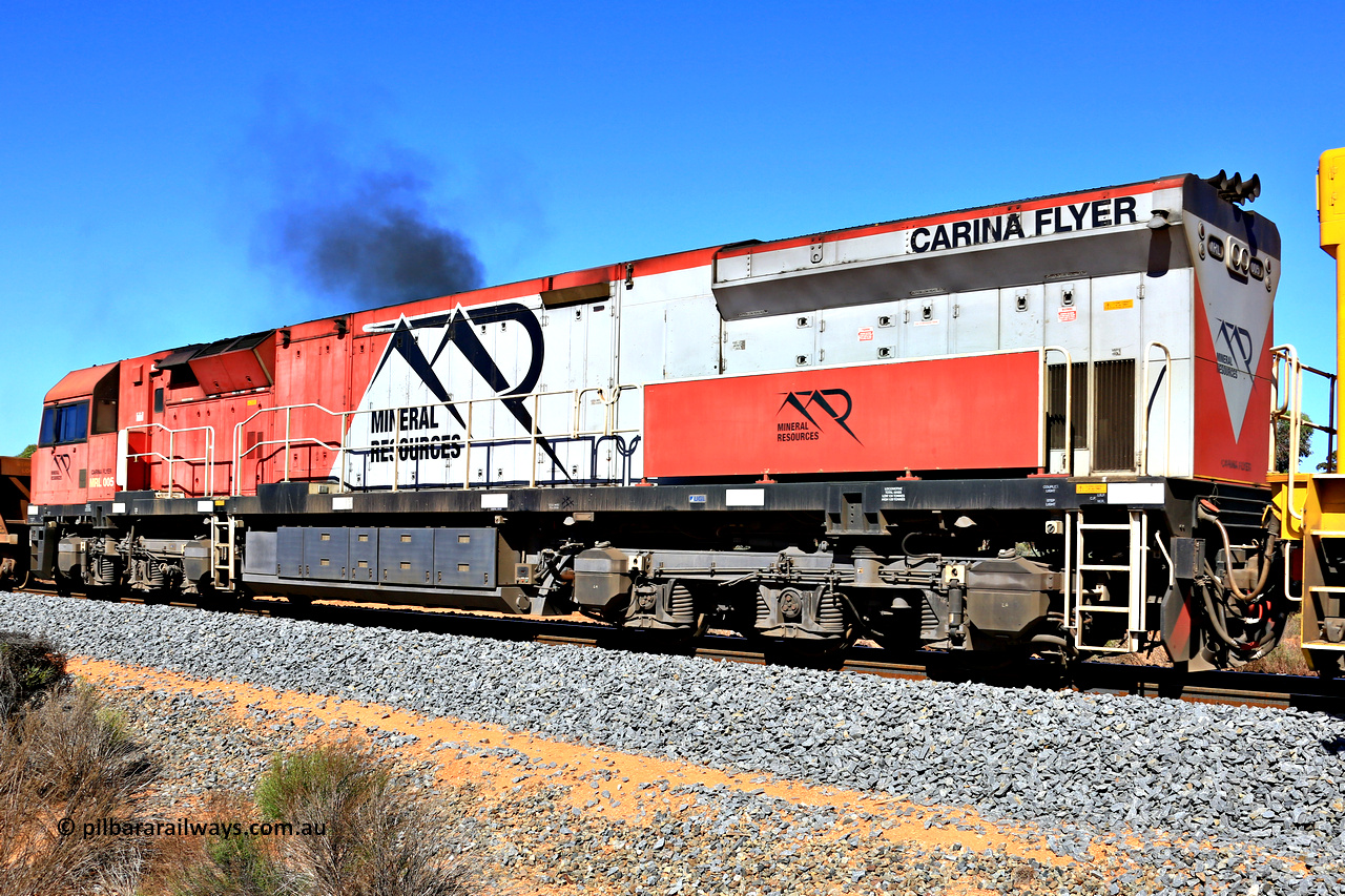 240328 2907
Feysville, Mineral Resources empty Mount Walton iron ore train 5040 with mid-train unit MRL 005 'Carina Flyer' with serial number R-0113-05/14-508 and is a UGL Rail Broadmeadow NSW built GE C44ACi model locomotive, one of six such units built for Mineral Resources in 2014. 28th March 2024.
Keywords: MRL-class;MRL005;UGL-Rail-Broadmeadow-NSW;GE;C44ACi;R-0113-05/14-508;