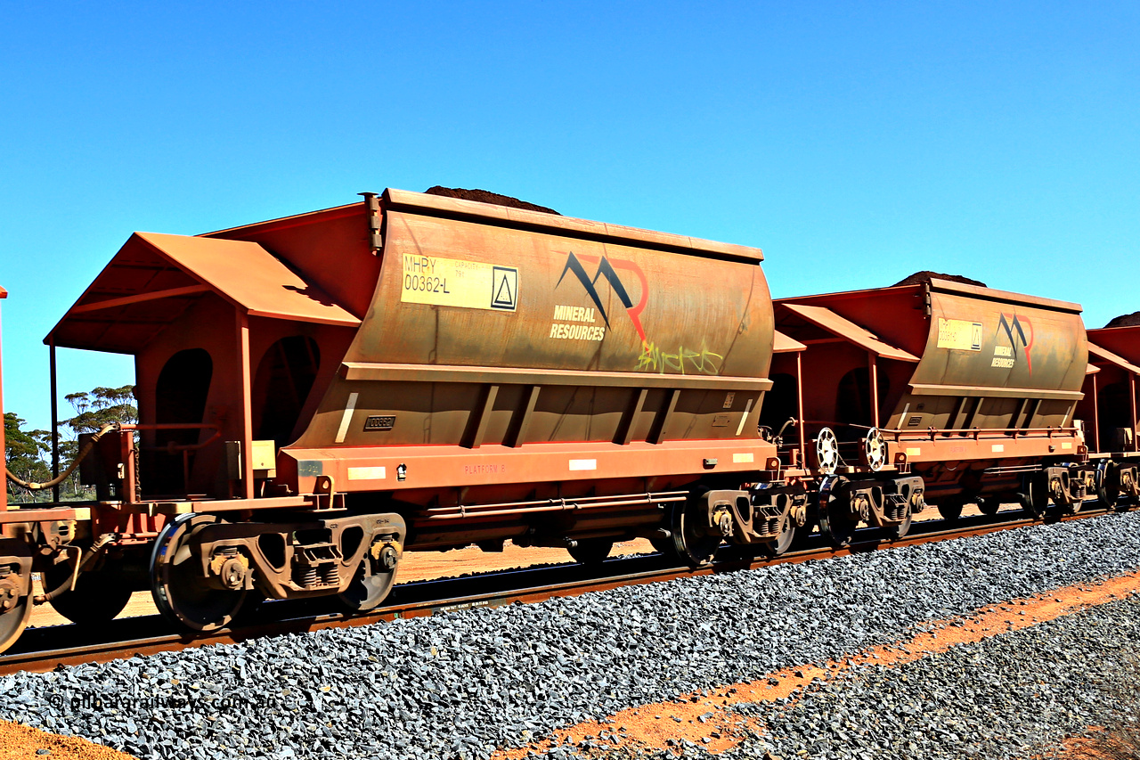 240328 2990
Loaded Koolyanobbing iron ore train 5041 with Mineral Resources Ltd MHPY type iron ore waggons MHPY 00362 and MHPY 00361 built by CSR Yangtze Co China with serial numbers 2014 / 382-362 and 2014 / 382-361 in 2014 as a batch of 382 pairs, these bottom discharge hopper waggons are operated in 'married' pairs. 28th of March 2024.
Keywords: MHPY-type;MHPY00362;2014/382-362;MHPY00361;2014/382-361;CSR-Yangtze-Rolling-Stock-Co-China;