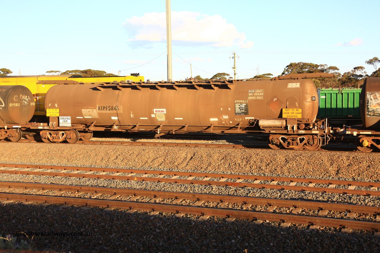 240328 3174
West Kalgoorlie, Viva Energy's ATPF 584 fuel tank waggon, built by Westrail Midland Workshops in 1980 as the final Shell WJP type 80.66 kL one compartment one dome tank. Original code and Shell Fleet No. TR 719 still visible, fitted with type F InterLock couplers, 80,500 SFL [safe fill level], on Pacific National's train 5445 empty fuel to Esperance. March 28, 2024.
Keywords: ATPF-type;ATPF584;Westrail-Midland-WS;WJP-type;