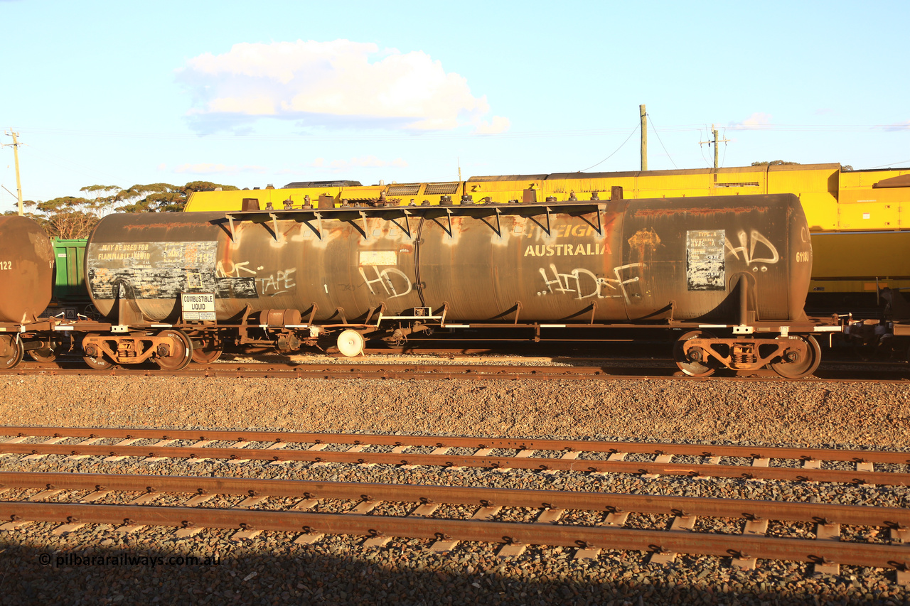 240328 3175
West Kalgoorlie, Viva Energy's NTBF type fuel tank waggon NTBF 6118, with former owners name (Freight Australia) visible. Originally built by Comeng NSW in 1975 as an SCA type 69,000 litre bitumen tanker SCA 267 for Shell NSW. Old code NTAF 6118 U is also visible with conventional couplers, Pacific National's 5445 empty fuel train to Esperance. March 28.2024.
Keywords: NTBF-type;NTBF6118;Comeng-NSW;SCA-type;SCA267;NTAF-type;