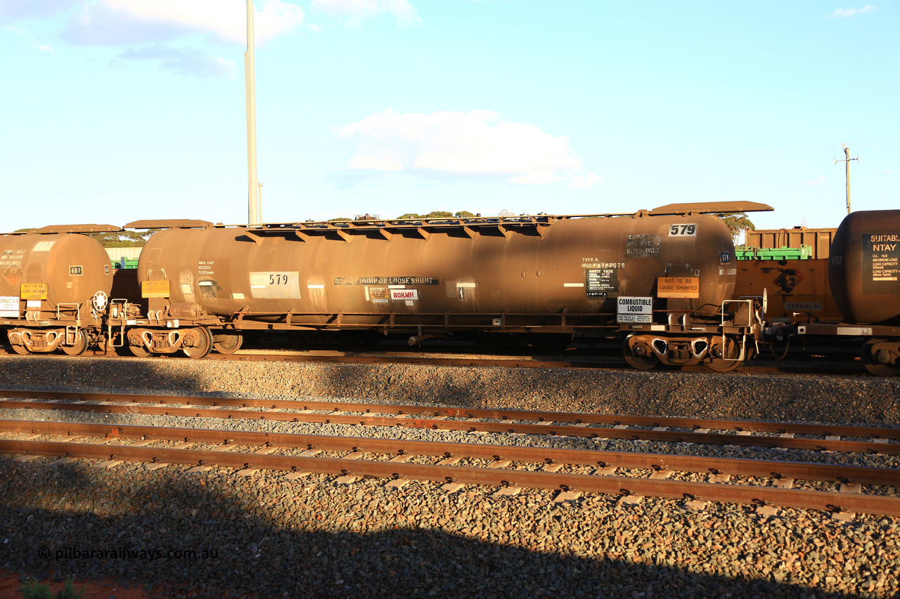 240328 3180
West Kalgoorlie, Viva Energy's APTF type fuel tank waggon ATPF 579 built by WAGR Midland Workshops in 1974 for Shell, in a batch of nine, as a WJP type 80,660 litre, one compartment one dome tank waggon, with a SFL of 80,500 litres, fitted with type F InterLock couplers. Pacific National empty fuel train 5445 to Esperance. March 28, 2024.
Keywords: ATPF-type;ATPF579;WAGR-Midland-WS;WJP-type;