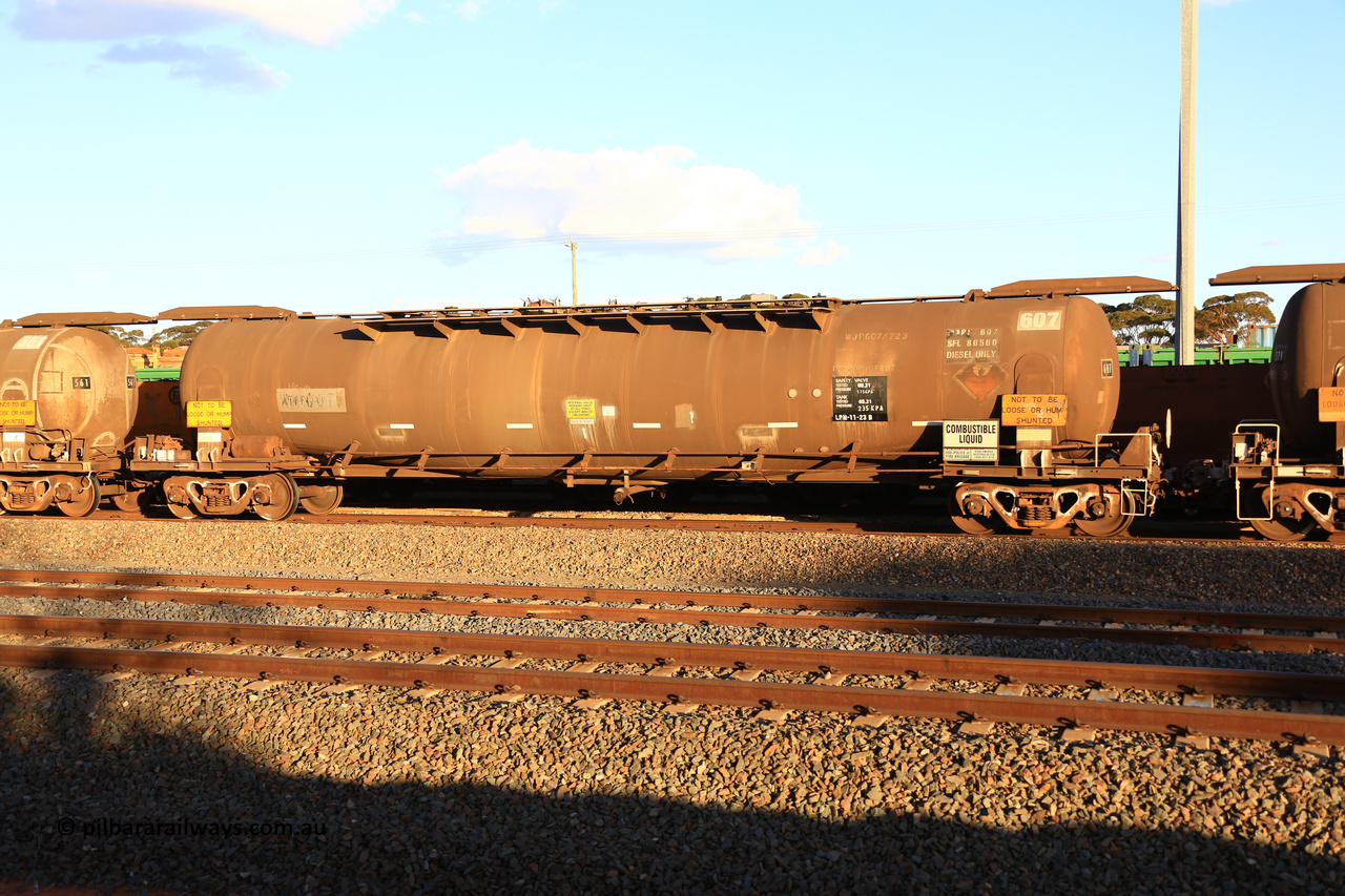 240328 3181
West Kalgoorlie, Viva Energy's APTF type fuel tank waggon ATPF 607 built by Westrail Midland Workshops in 1982 for Shell, in a batch of two, as a WJP type, 80,660 litre, one compartment one dome, with a SFL of 80,500 litres, fitted with type F InterLock couplers. Pacific National empty fuel train 5445 to Esperance. March 28, 2024.
Keywords: ATPF-type;ATPF607;Westrail-Midland-WS;WJP-type;