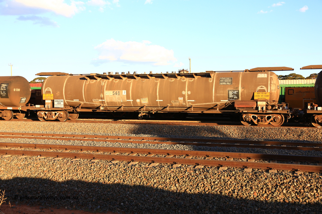 240328 3182
West Kalgoorlie, Viva Energy's ATLF type fuel tank waggon ATLF 561, built by WAGR Midland Workshops 1973 for Shell, in a batch of two, as type WJL with 86,490 litre capacity, one compartment one dome, fitted with type F InterLock couplers and a safe fill level of 80,500 litres. Pacific National empty fuel train 5445 to Esperance. March 28, 2024.
Keywords: ATLF-type;ATLF561;WAGR-Midland-WS;WJL-type;