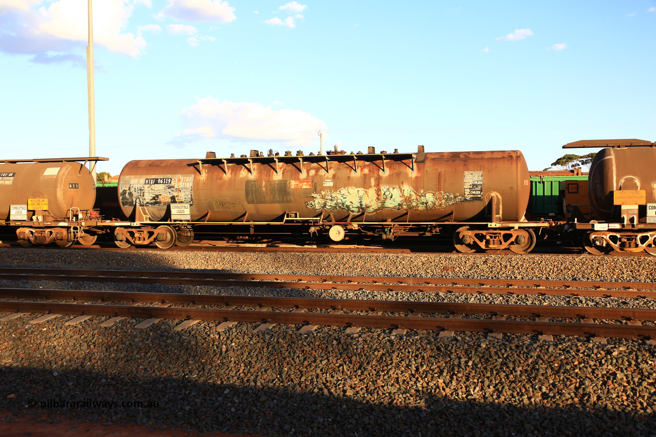 240328 3185
West Kalgoorlie, Viva Energy's NTBF type fuel tank waggon NTBF 6119, with a leading zero added, originally built by Comeng NSW in 1975 as SCA type SCA 270 a 69,000 litre bitumen tanker for Shell NSW, diesel capacity of 62,700 litres. Freight Australia painted out in middle of tank, normal E type couplers and old NTAF 6119 G number visible. Pacific National empty fuel train 5445 to Esperance. March 28, 2024.
Keywords: NTBF-type;NTBF6119;Comeng-NSW;SCA-type;SCA270;