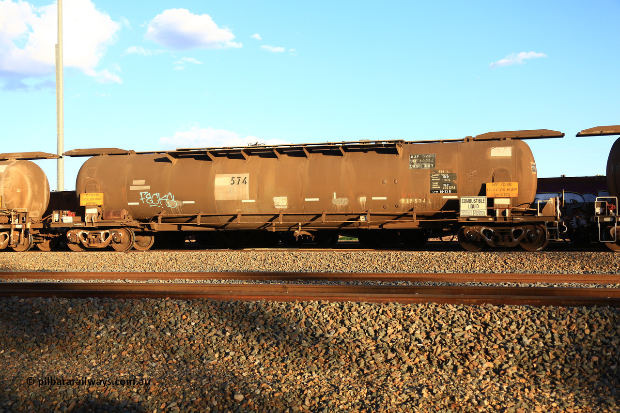 240328 3190
West Kalgoorlie, Viva Energy's APTF type fuel tank waggon ATPF 574 built by WAGR Midland Workshops in 1974 for Shell, in a batch of nine, as a WJP type 80,660 litre, one compartment one dome tank waggon, with a SFL of 80,500 litres, fitted with type F InterLock couplers. Pacific National empty fuel train 5445 to Esperance. March 28, 2024.
Keywords: ATPF-type;ATPF574;WAGR-Midland-WS;WJP-type;