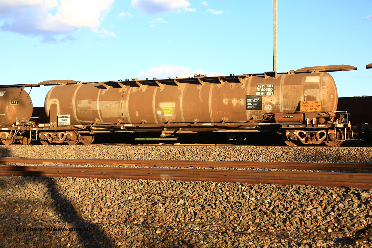 240328 3191
West Kalgoorlie, Viva Energy's APTF type fuel tank waggon ATPF 581 built by WAGR Midland Workshops in 1976 for Shell, in a batch of three, as a WJP type 80,660 litre, one compartment one dome tank waggon, with a SFL of 80,500 litres, fitted with type F InterLock couplers. Pacific National empty fuel train 5445 to Esperance. March 28, 2024.
Keywords: ATPF-type;ATPF581;WAGR-Midland-WS;WJP-type;