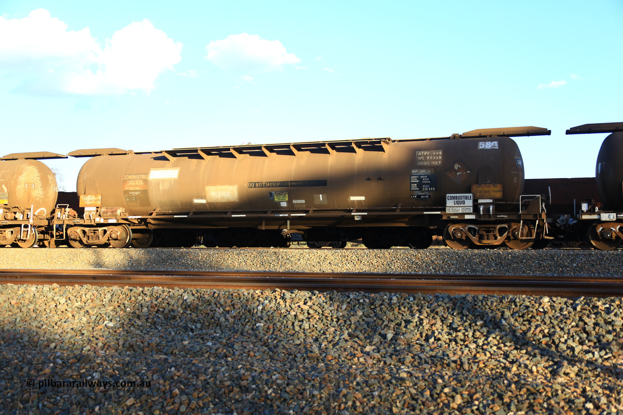 240328 3194
West Kalgoorlie, Viva Energy's APTF type fuel tank waggon ATPF 580 built by WAGR Midland Workshops in 1976 for Shell, in a batch of three, as a WJP type 80,660 litre, one compartment one dome tank waggon, with a SFL of 80,500 litres, fitted with type F InterLock couplers. Pacific National empty fuel train 5445 to Esperance. March 28, 2024.
Keywords: ATPF-type;ATPF580;WAGR-Midland-WS;WJP-type;