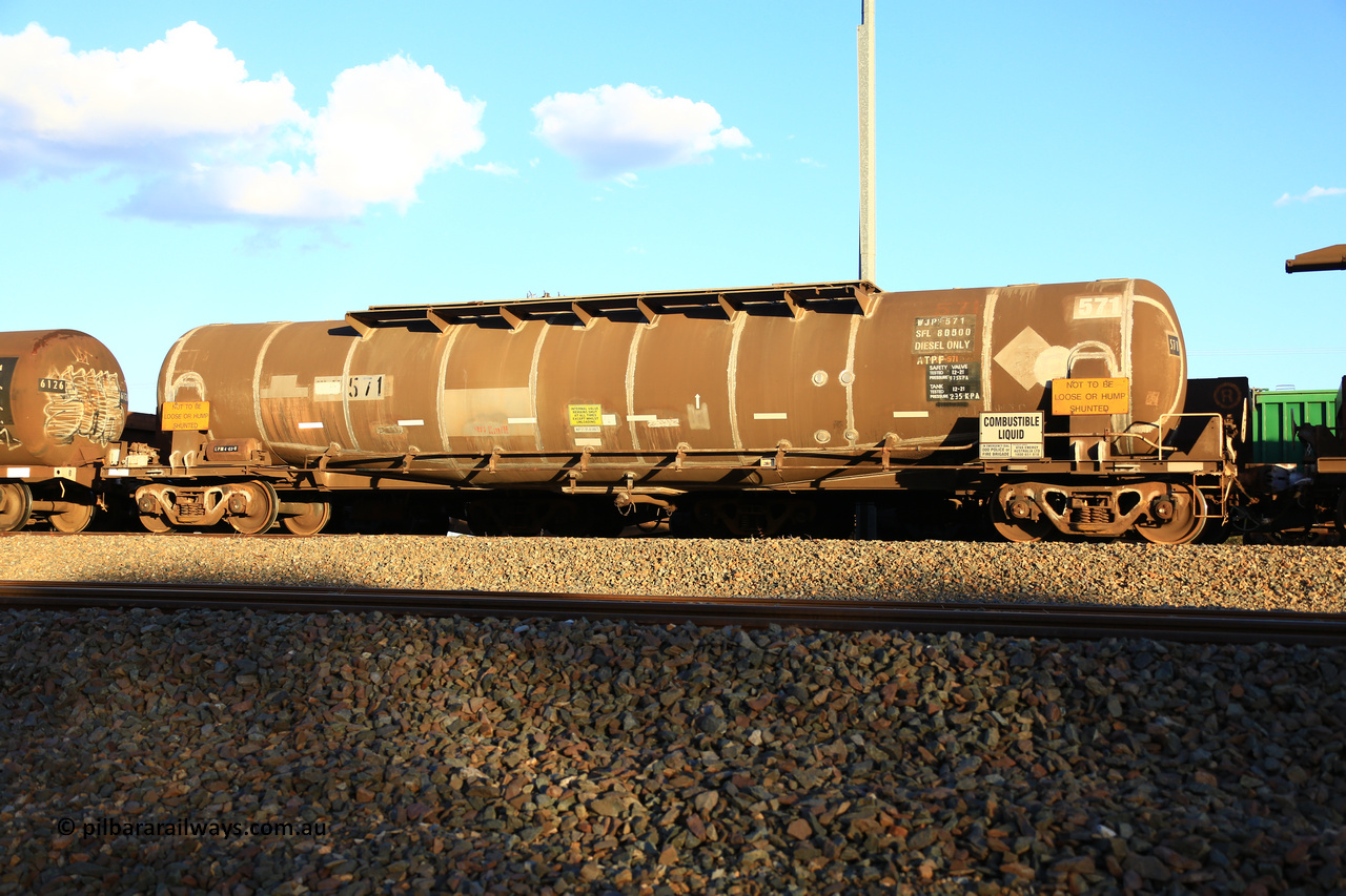 240328 3196
West Kalgoorlie, Viva Energy's APTF type fuel tank waggon ATPF 571, class leader, built by WAGR Midland Workshops in 1974 for Shell, in a batch of nine, as a WJP type 80,660 litre, one compartment one dome tank waggon, with a SFL of 80,500 litres, fitted with type F InterLock couplers. Pacific National empty fuel train 5445 to Esperance. March 28, 2024.
Keywords: ATPF-type;ATPF571;WAGR-Midland-WS;WJP-type;