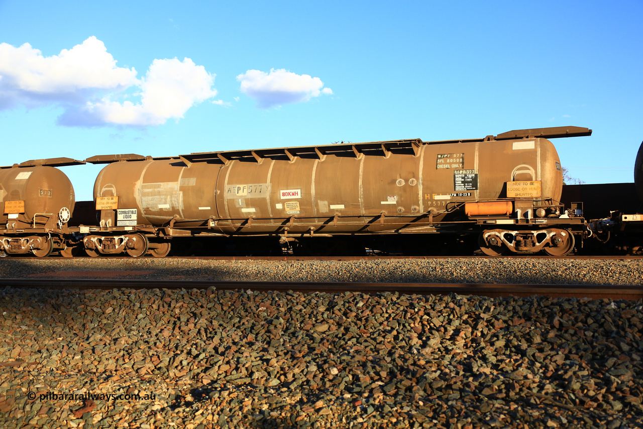 240328 3198
West Kalgoorlie, Viva Energy's APTF type fuel tank waggon ATPF 577 built by WAGR Midland Workshops in 1974 for Shell, in a batch of nine, as a WJP type 80,660 litre, one compartment one dome tank waggon, with a SFL of 80,500 litres, fitted with type F InterLock couplers. Pacific National empty fuel train 5445 to Esperance. March 28, 2024.
Keywords: ATPF-type;ATPF577;WAGR-Midland-WS;WJP-type;