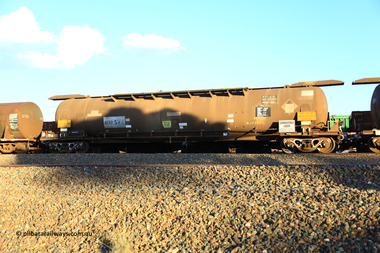 240328 3199
West Kalgoorlie, Viva Energy's APTF type fuel tank waggon ATPF 572 built by WAGR Midland Workshops in 1974 for Shell, in a batch of nine, as a WJP type 80,660 litre, one compartment one dome tank waggon, with a SFL of 80,500 litres, fitted with type F InterLock couplers. Pacific National empty fuel train 5445 to Esperance. March 28, 2024.
Keywords: ATPF-type;ATPF572;WAGR-Midland-WS;WJP-type;