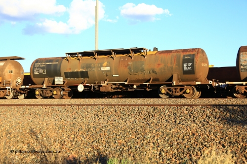 240328 3201
West Kalgoorlie, Viva Energy's NTAY type fuel tank waggon NTAY 6129 built by Indeng, Qld in 1976, in a batch of four, for Shell as an SCA type 65,000 litre one compartment oil tank SCA 280. Recoded to NTAF 280, then NTAF 6129. Diesel capacity of 61,660 litres. Freight Australia painted out in middle of tank and fitted with conventional couplers. Pacific National empty fuel train 5445 to Esperance. March 28, 2024.
Keywords: NTAY-type;NTAY6129;Indeng-Qld;SCA-type;SCA280;NTAF-type;