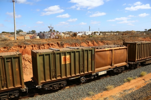 161112 3032
West Kalgoorlie, loaded Malcolm sulphur train 6029, CQZY type waggon CQZY 1690, built by CIMC at Dalian China for CFCLA and one of fifteen on lease to Aurizon with original style sulphur container S7N G836 with sliding tarpaulin and Bis Industries hard-top type 25U0 container BISU 100105.
Keywords: CQZY-type;CQZY1690;CIMC-Dalian-China;