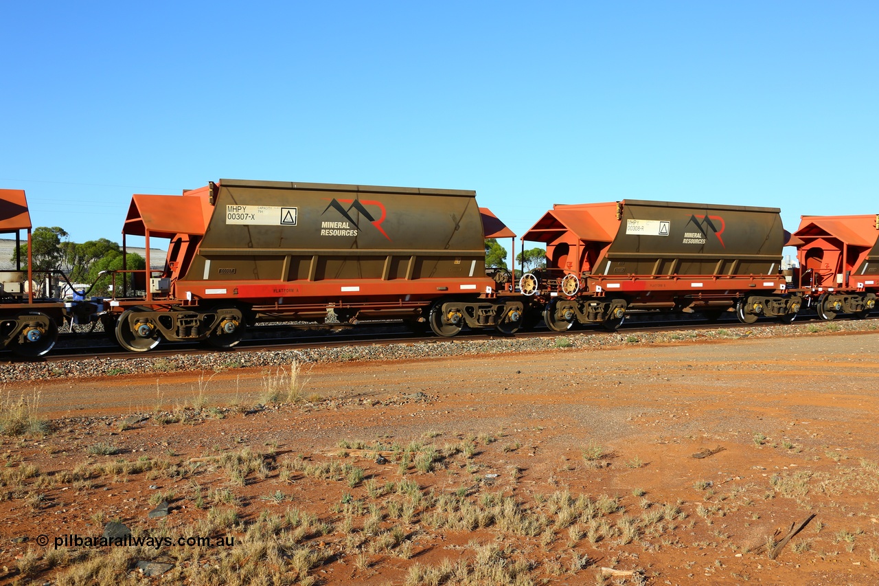 190107 0435
Parkeston, Mineral Resources Ltd MHPY type iron ore waggon married pair set MHPY 00307 and MHPY 00308 built by CSR Yangtze Co China in 2014 as a batch of 382 units, these bottom discharge hopper waggons are operated in 'married' pairs.
Keywords: MHPY-type;MHPY00307;2014/382-307;CSR-Yangtze-Rolling-Stock-Co-China;