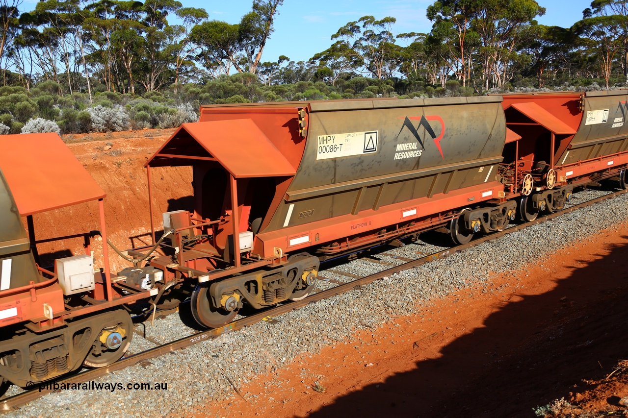190109 1569
Binduli, Mineral Resources Ltd empty iron ore train 4030 with MRL's MHPY type iron ore waggon MHPY 00085 built by CSR Yangtze Co China serial 2014/382-85 in 2014 as a batch of 382 units, these bottom discharge hopper waggons are operated in 'married' pairs.
Keywords: MHPY-type;MHPY00086;2014/382-86;CSR-Yangtze-Co-China;