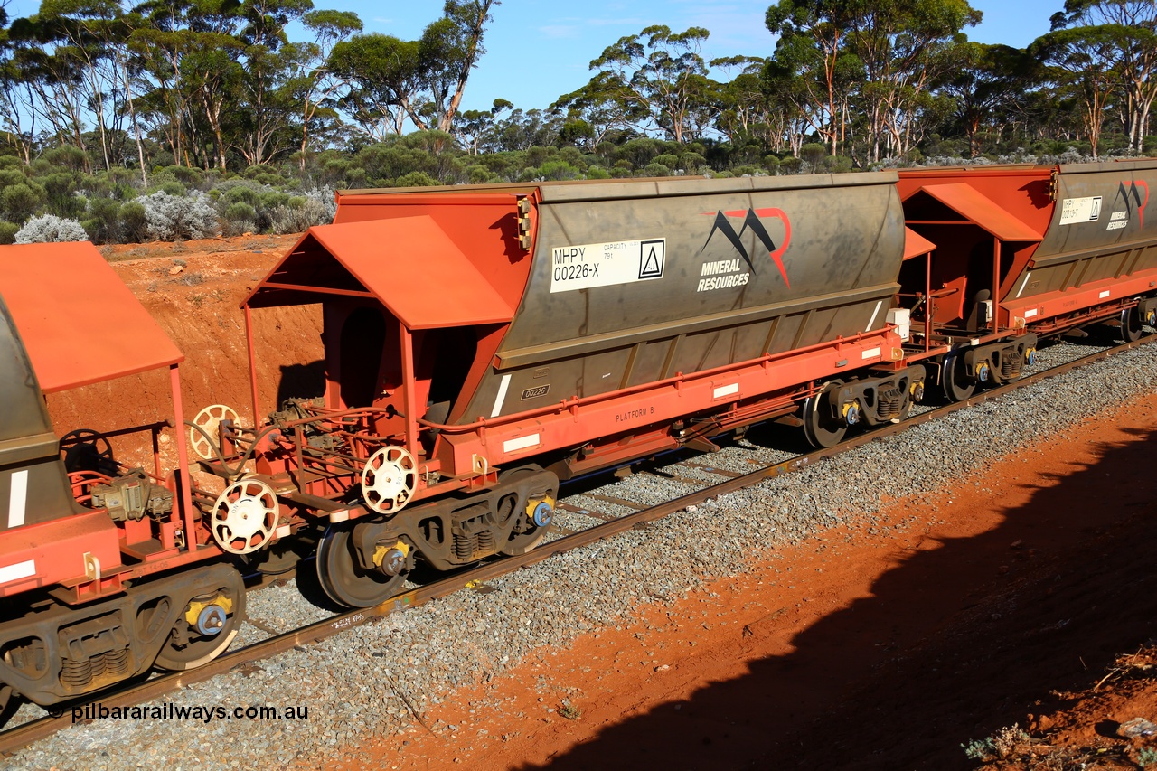 190109 1576
Binduli, Mineral Resources Ltd empty iron ore train 4030 with MRL's MHPY type iron ore waggon MHPY 00213 built by CSR Yangtze Co China serial 2014/382-213 in 2014 as a batch of 382 units, these bottom discharge hopper waggons are operated in 'married' pairs.
Keywords: MHPY-type;MHPY00226;2014/382-226;CSR-Yangtze-Co-China;