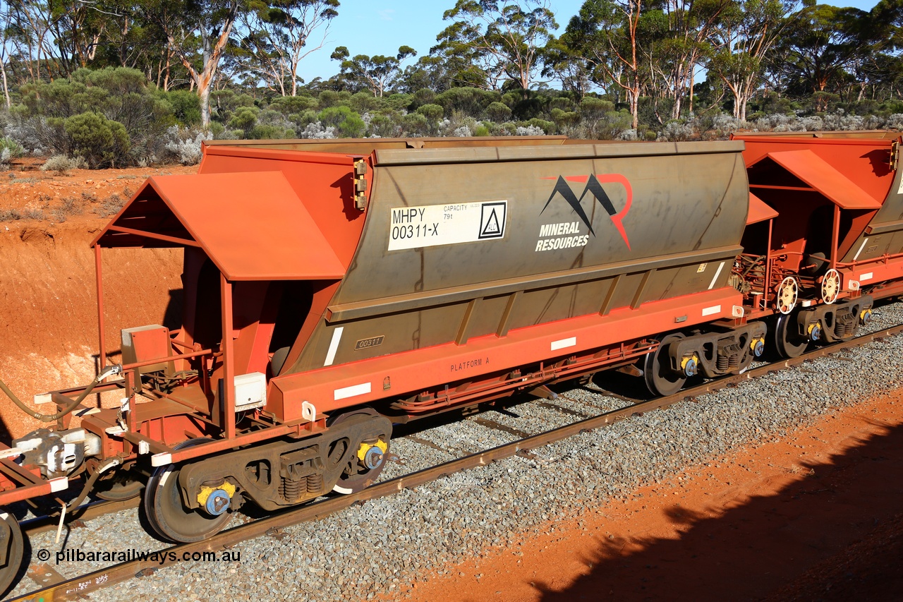 190109 1605
Binduli, Mineral Resources Ltd empty iron ore train 4030 with MRL's MHPY type iron ore waggon MHPY 00311 built by CSR Yangtze Co China serial 2014/382-311 in 2014 as a batch of 382 units, these bottom discharge hopper waggons are operated in 'married' pairs.
Keywords: MHPY-type;MHPY00311;2014/382-311;CSR-Yangtze-Co-China;